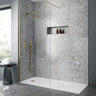 Brushed brass walk in shower screen and shower tray enclosure bundle packs - image shows a brushed brass shower screen with a white walk in shower tray in a modern grey bathroom