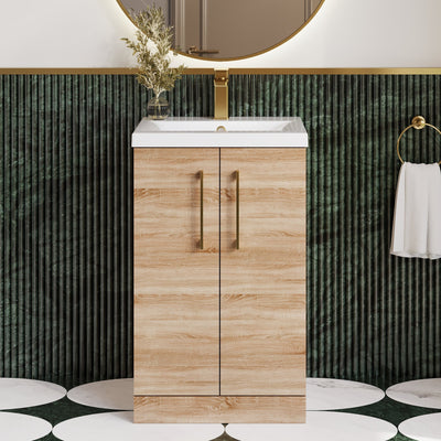 Lana Bleached Oak 500mm floorstanding vanity unit with brushed brass fittings and a green tiled room