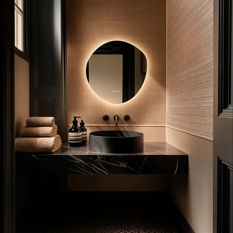 Claris Organic 60 x 58cm LED bathroom mirror with touch sensor and backlit frame, styled in a luxury bathroom with matt black tap and modern basin - Origins Living mirror at BathLab