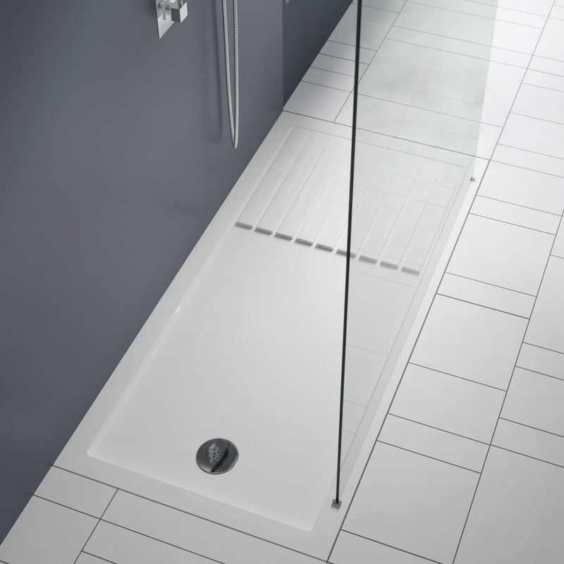 White walk in shower tray with glass screen and chrome waste