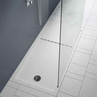 White walk in shower tray with glass screen and chrome waste