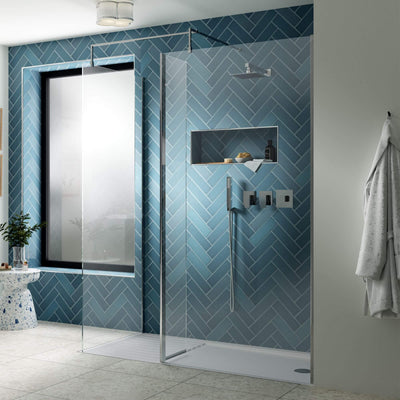 Vista 8mm chrome walk in shower screen on a white walk in shower tray with optional deflector panel and return panel